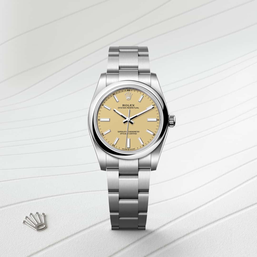 Rolex Oyster Perpetual 34 in Oystersteel with a beige dial, domed bezel, and Oyster bracelet.