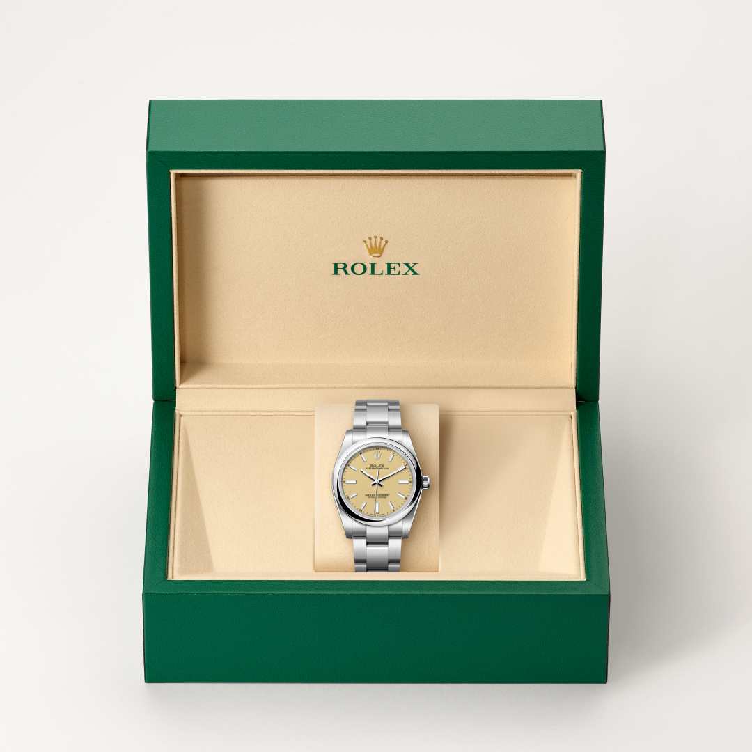Rolex Oyster Perpetual 34 in Oystersteel with a beige dial, domed bezel, and Oyster bracelet.
