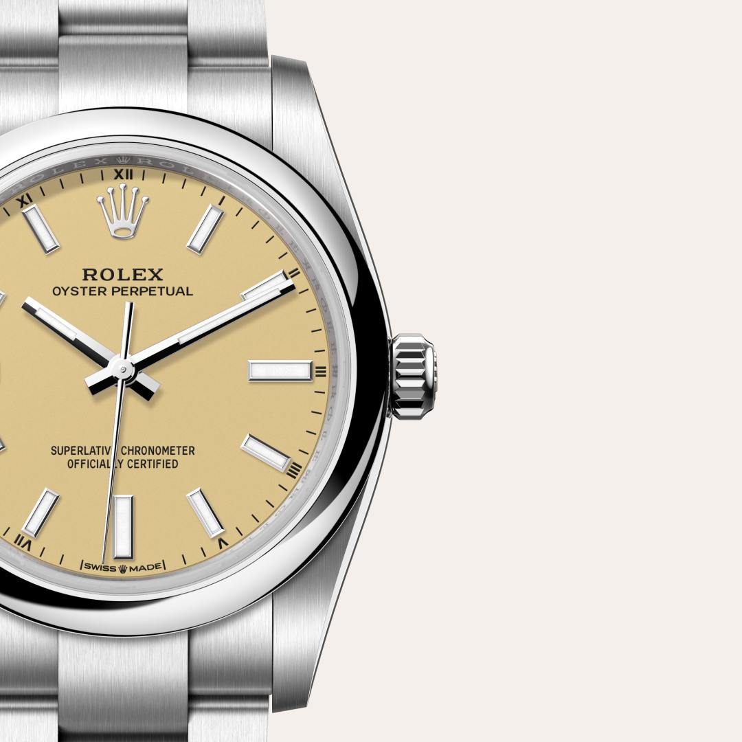 Rolex Oyster Perpetual 34 in Oystersteel with a beige dial, domed bezel, and Oyster bracelet.