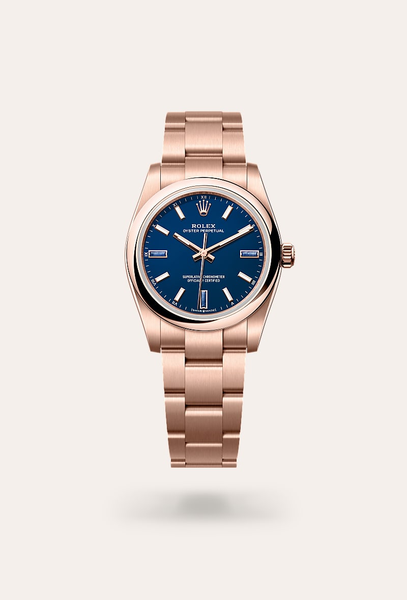 Rolex Oyster Perpetual 34 in 18 ct Everose gold with a blue stone dial, domed bezel, and Oyster bracelet.
