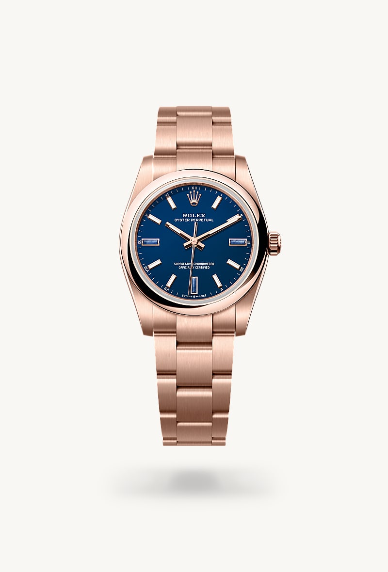 Rolex Oyster Perpetual 34 in 18 ct Everose gold with a blue stone dial, domed bezel, and Oyster bracelet.