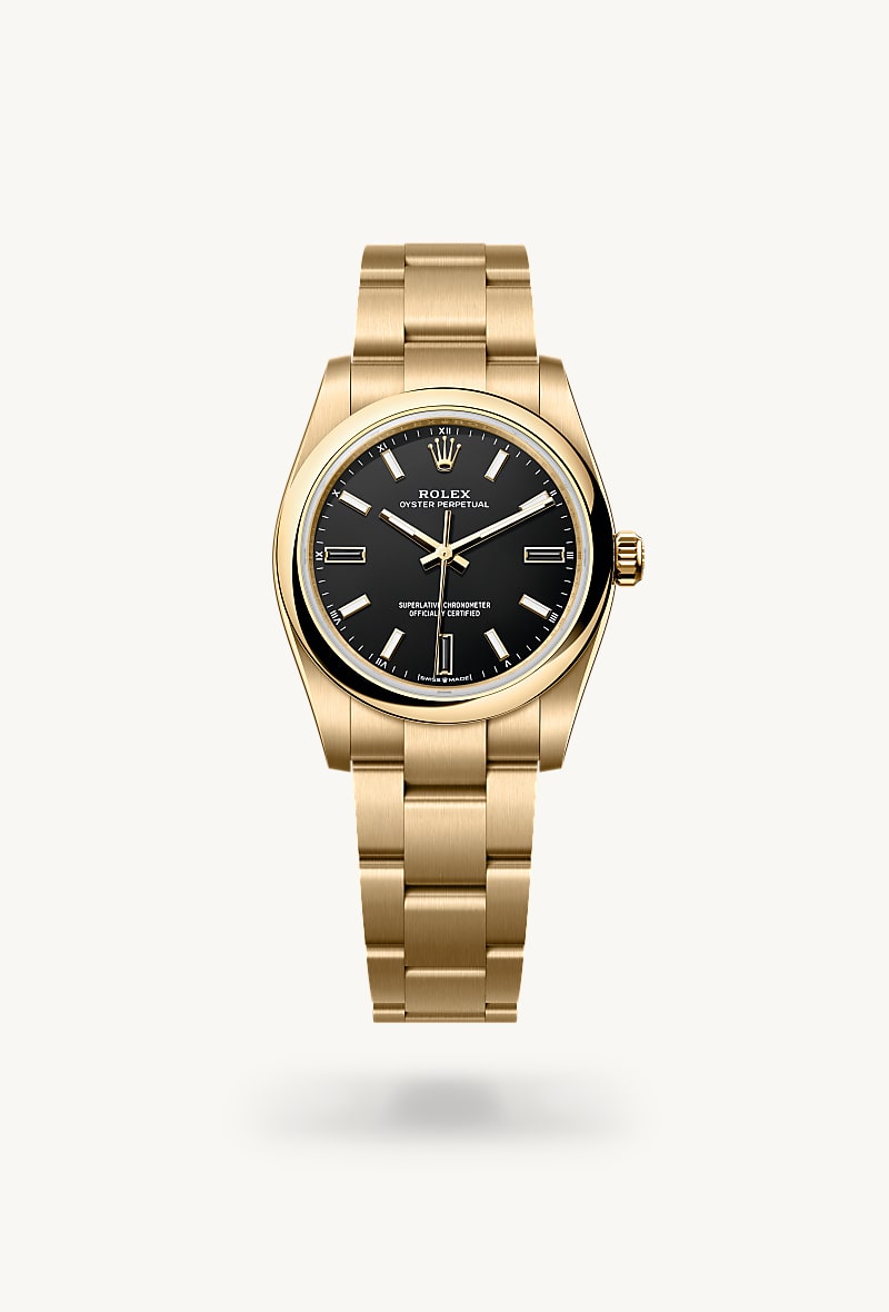 Rolex Oyster Perpetual 34 in 18 ct yellow gold with a black dial, domed bezel, and Oyster bracelet.
