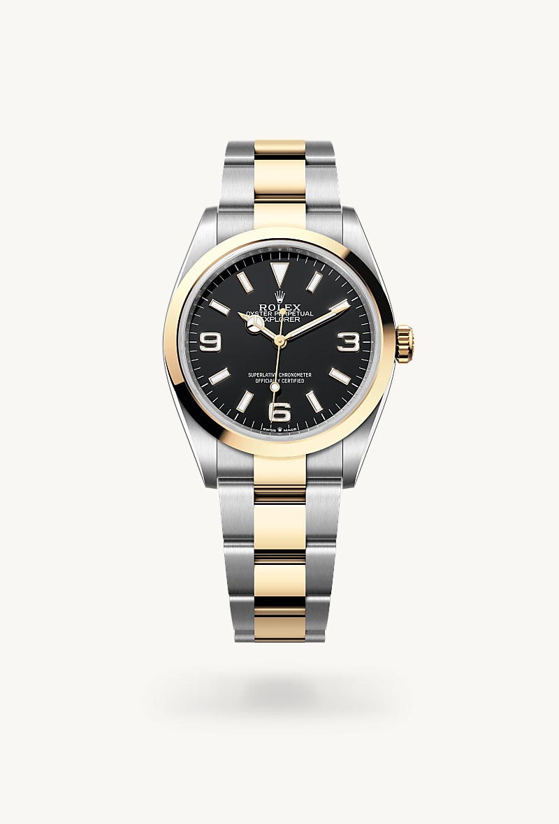 Rolex Explorer 36 in Yellow Rolesor with a black dial, smooth bezel, and Oyster bracelet.