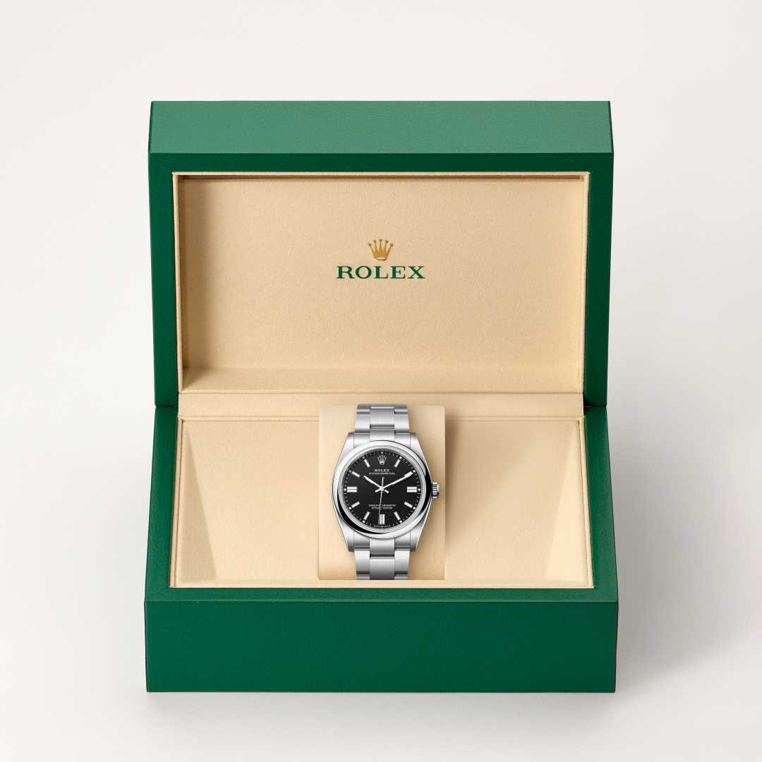 Rolex Oyster Perpetual 36 in Oystersteel with a black dial, domed bezel, and Oyster bracelet.