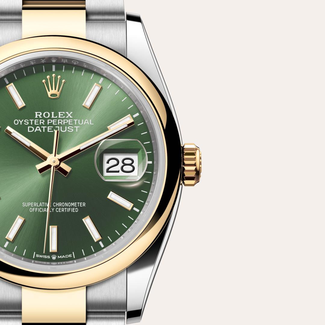 Rolex Datejust 36 in Yellow Rolesor with a olive green dial, domed bezel, and Oyster bracelet.