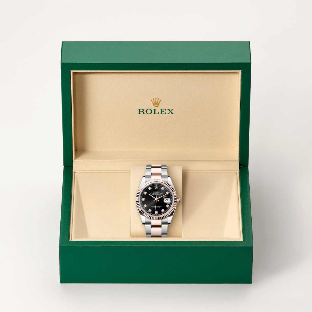 Rolex Datejust 36 in Everose Rolesor with a bright black set with diamonds dial, fluted bezel, and Oyster bracelet.