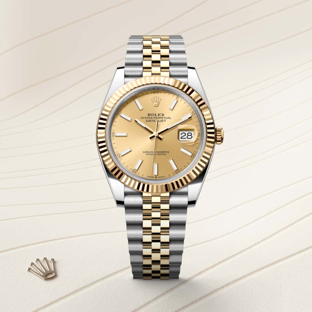 Rolex Datejust 41 in Yellow Rolesor with a champagne-colour dial, fluted bezel, and Jubilee bracelet.