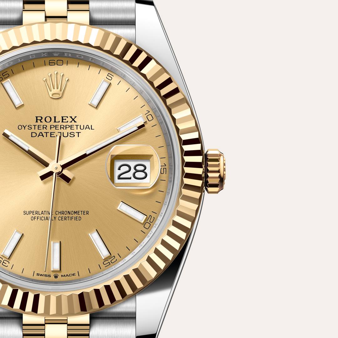 Rolex Datejust 41 in Yellow Rolesor with a champagne-colour dial, fluted bezel, and Jubilee bracelet.