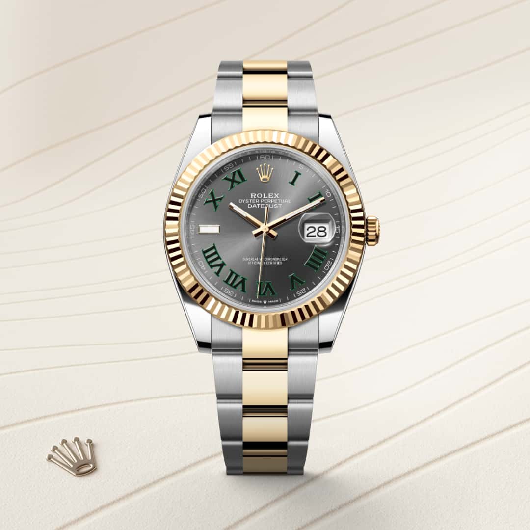 Rolex Datejust 41 in Yellow Rolesor with a slate dial, fluted bezel, and Oyster bracelet.