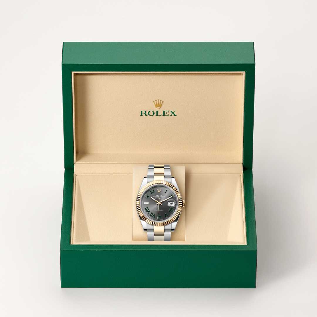 Rolex Datejust 41 in Yellow Rolesor with a slate dial, fluted bezel, and Oyster bracelet.