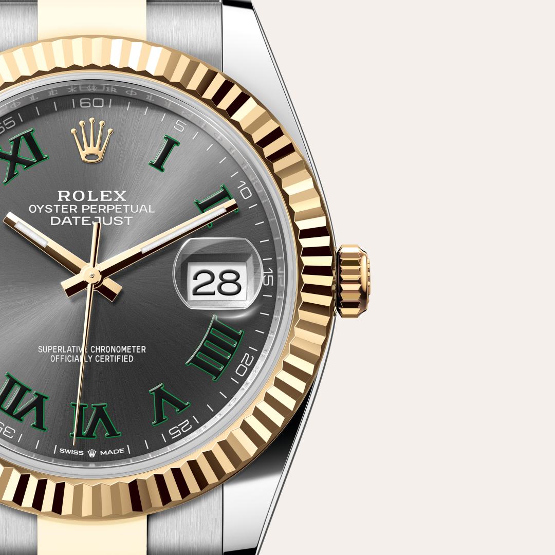 Rolex Datejust 41 in Yellow Rolesor with a slate dial, fluted bezel, and Oyster bracelet.