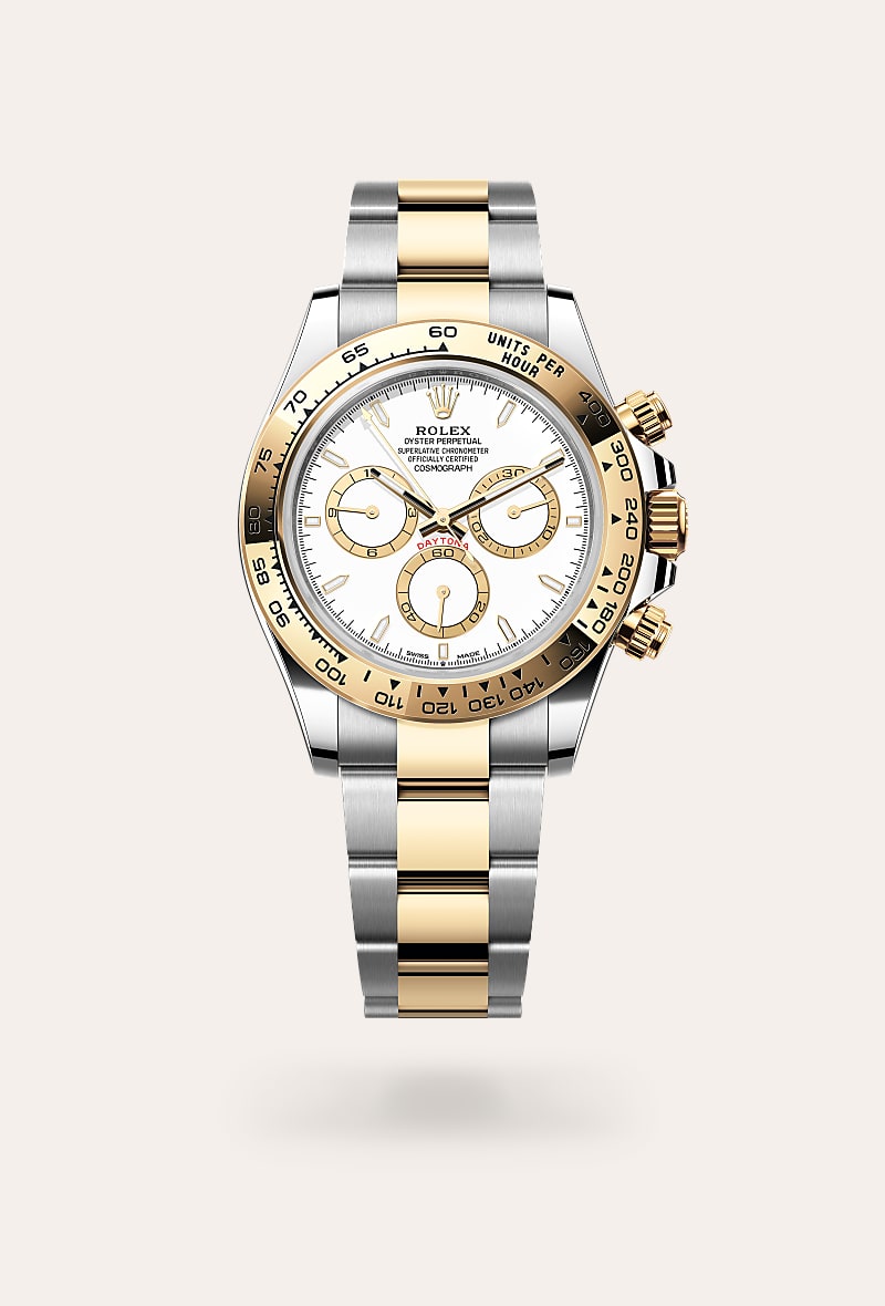Rolex Cosmograph Daytona in Yellow Rolesor with a white, golden counter rings dial, fixed, with engraved tachymetric scale, in yellow gold bezel, and Oyster bracelet.