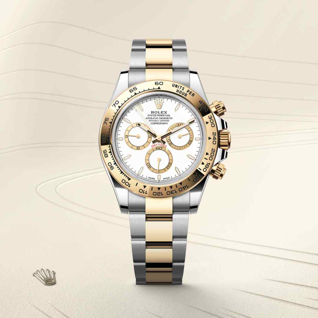 Rolex Cosmograph Daytona in Yellow Rolesor with a white, golden counter rings dial, fixed, with engraved tachymetric scale, in yellow gold bezel, and Oyster bracelet.