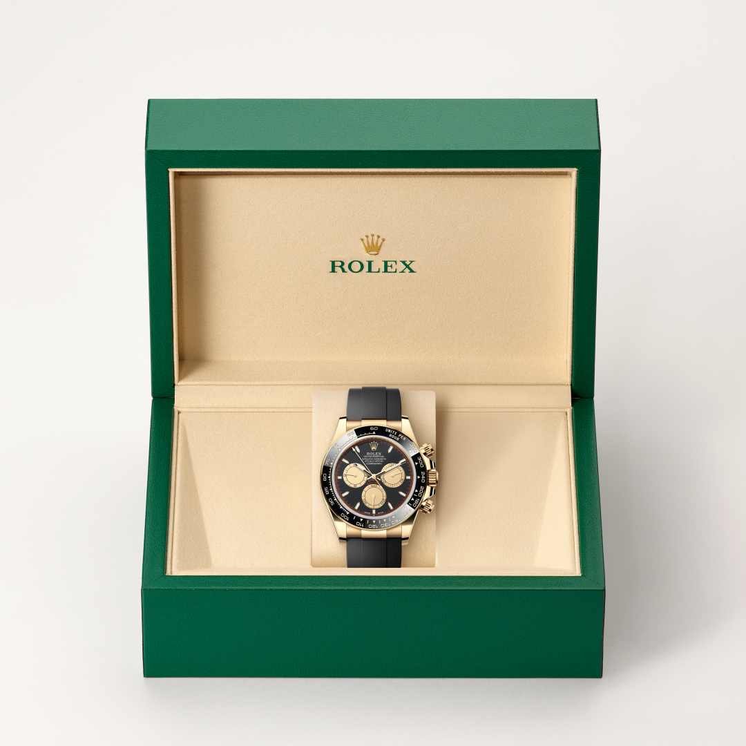 Rolex Cosmograph Daytona in 18 ct yellow gold with a intense black and champagne-colour dial, black monobloc cerachrom bezel in ceramic with moulded tachymetric scale bezel, and Oysterflex bracelet.