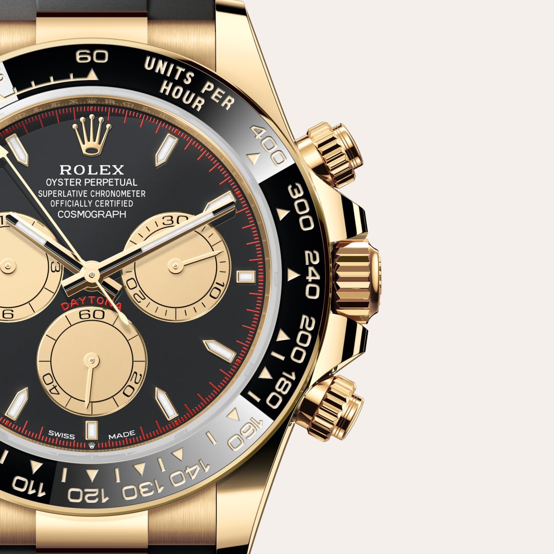 Rolex Cosmograph Daytona in 18 ct yellow gold with a intense black and champagne-colour dial, black monobloc cerachrom bezel in ceramic with moulded tachymetric scale bezel, and Oysterflex bracelet.