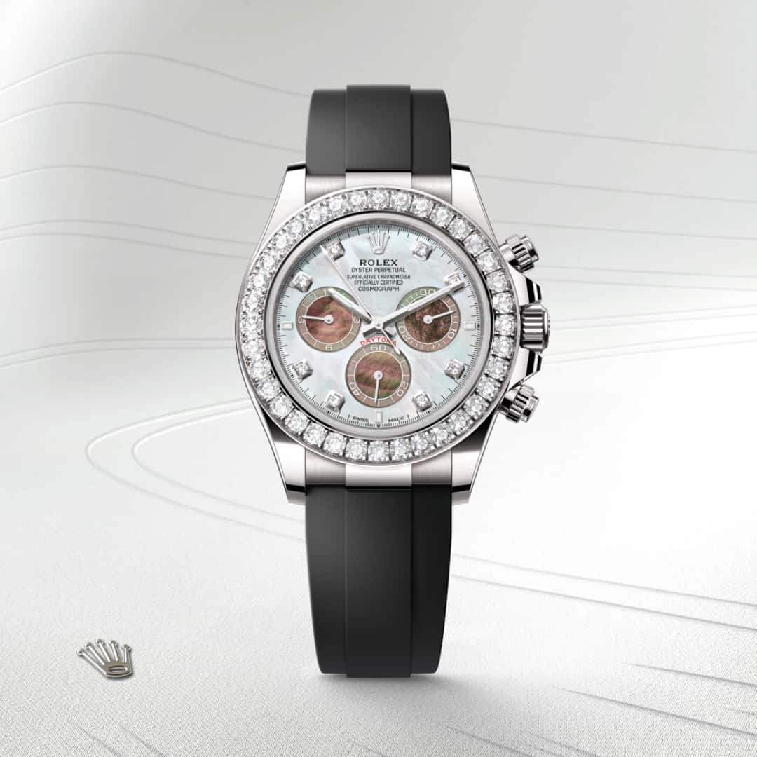 Rolex Cosmograph Daytona in 18 kt white gold with a white and black mother-of-pearl set with diamonds dial, set with diamonds bezel, and Oysterflex bracelet.
