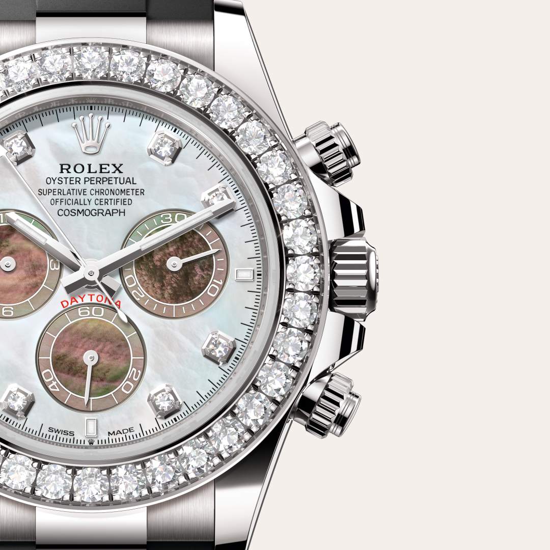 Rolex Cosmograph Daytona in 18 kt white gold with a white and black mother-of-pearl set with diamonds dial, set with diamonds bezel, and Oysterflex bracelet.