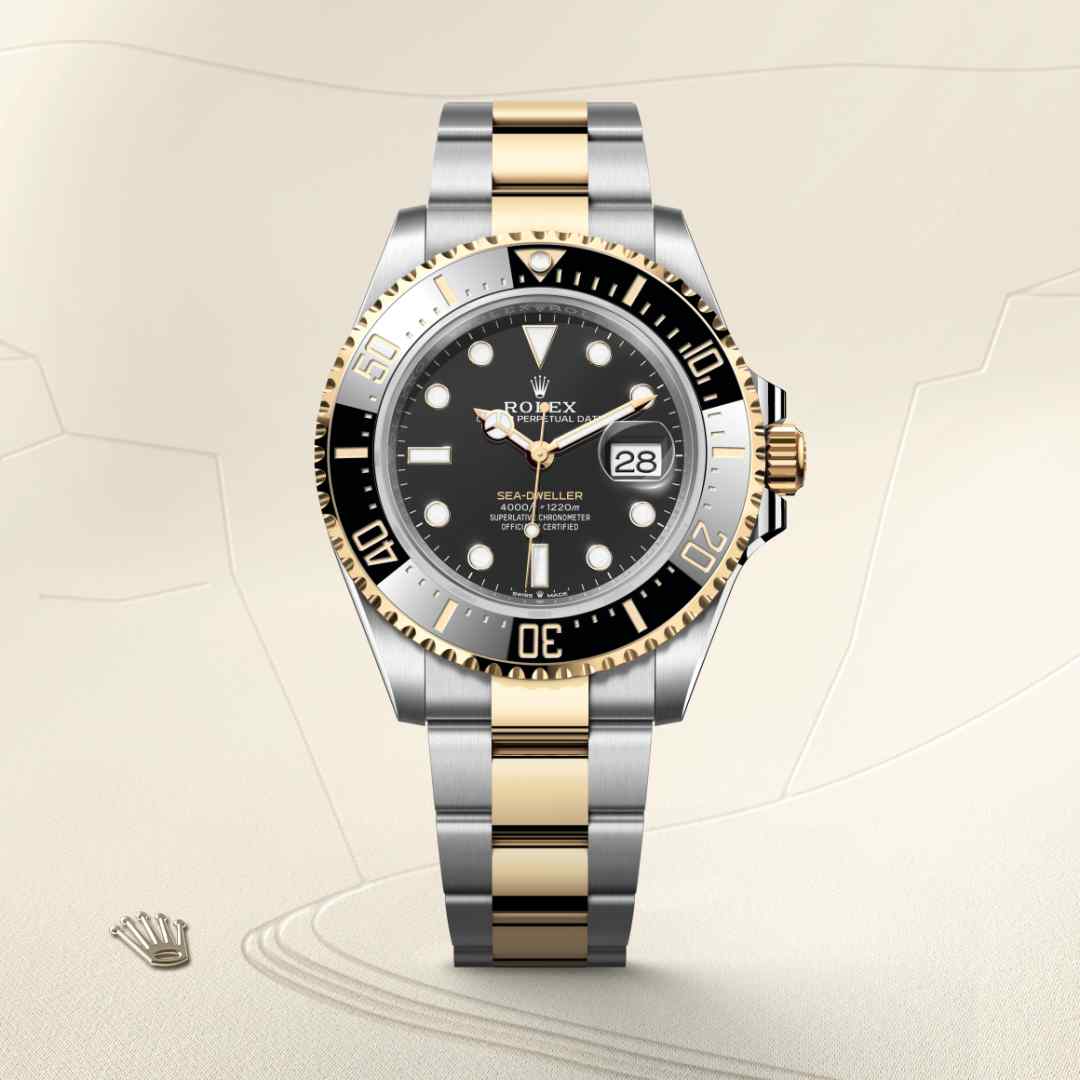 Rolex Sea-Dweller in Yellow Rolesor with a intense black dial, unidirectional rotatable 60-minute graduated, scratch-resistant cerachrom insert in black ceramic, numerals and graduations coated in gold bezel, and Oyster bracelet.