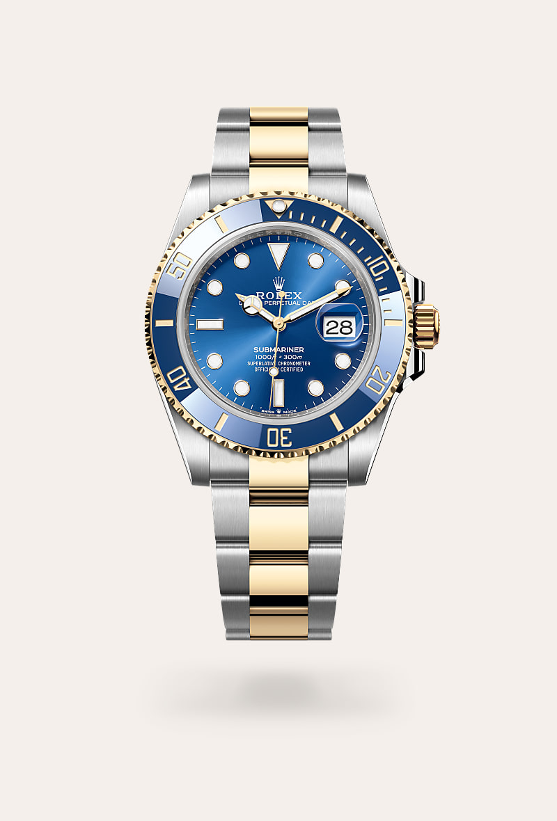 Rolex Submariner Date in Yellow Rolesor with a royal blue dial, unidirectional rotatable 60-minute graduated, scratch-resistant cerachrom insert in blue ceramic, numerals and graduations coated in gold bezel, and Oyster bracelet.