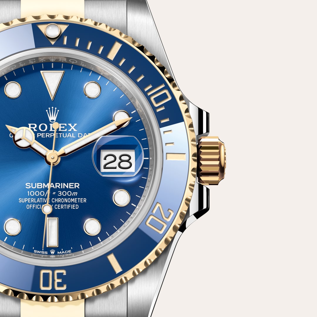 Rolex Submariner Date in Yellow Rolesor with a royal blue dial, unidirectional rotatable 60-minute graduated, scratch-resistant cerachrom insert in blue ceramic, numerals and graduations coated in gold bezel, and Oyster bracelet.