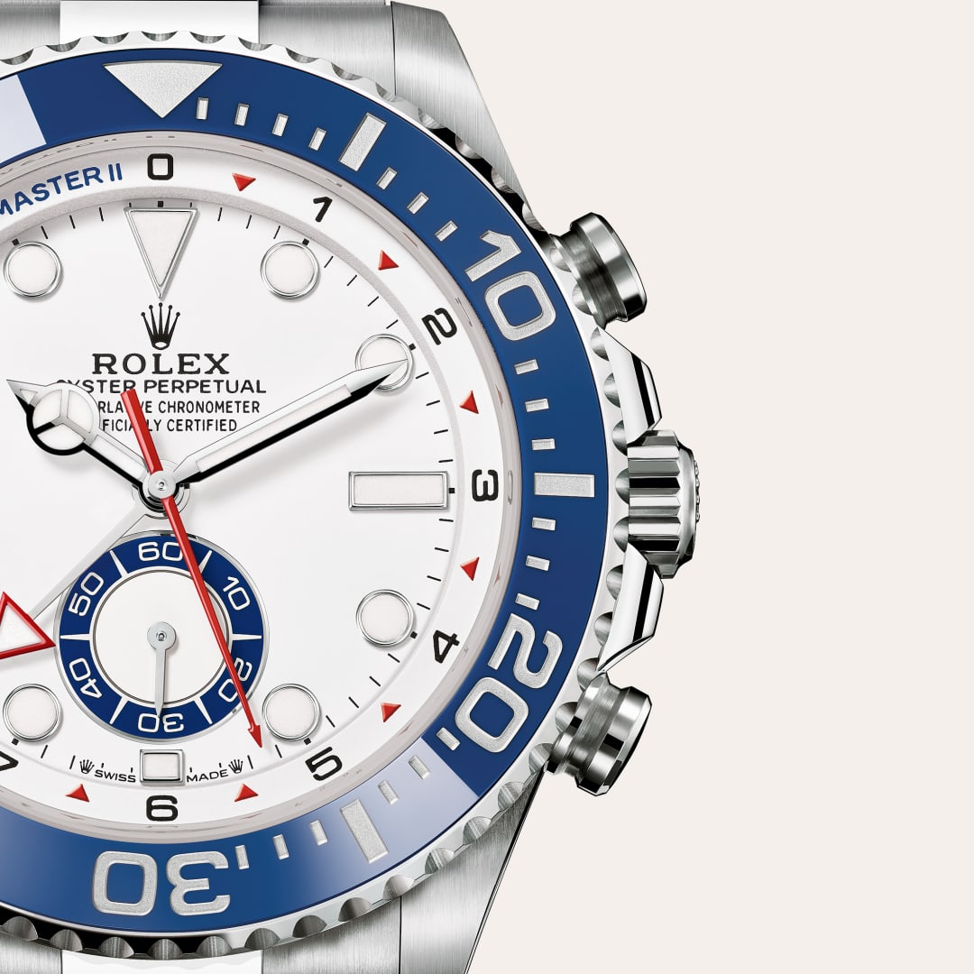 Rolex Yacht-Master II in Oystersteel with a white dial, bidirectional rotatable 60-minute graduated bezel with blue cerachrom insert in ceramic. moulded, recessed graduations and numerals coated with platinum bezel, and Oyster bracelet.