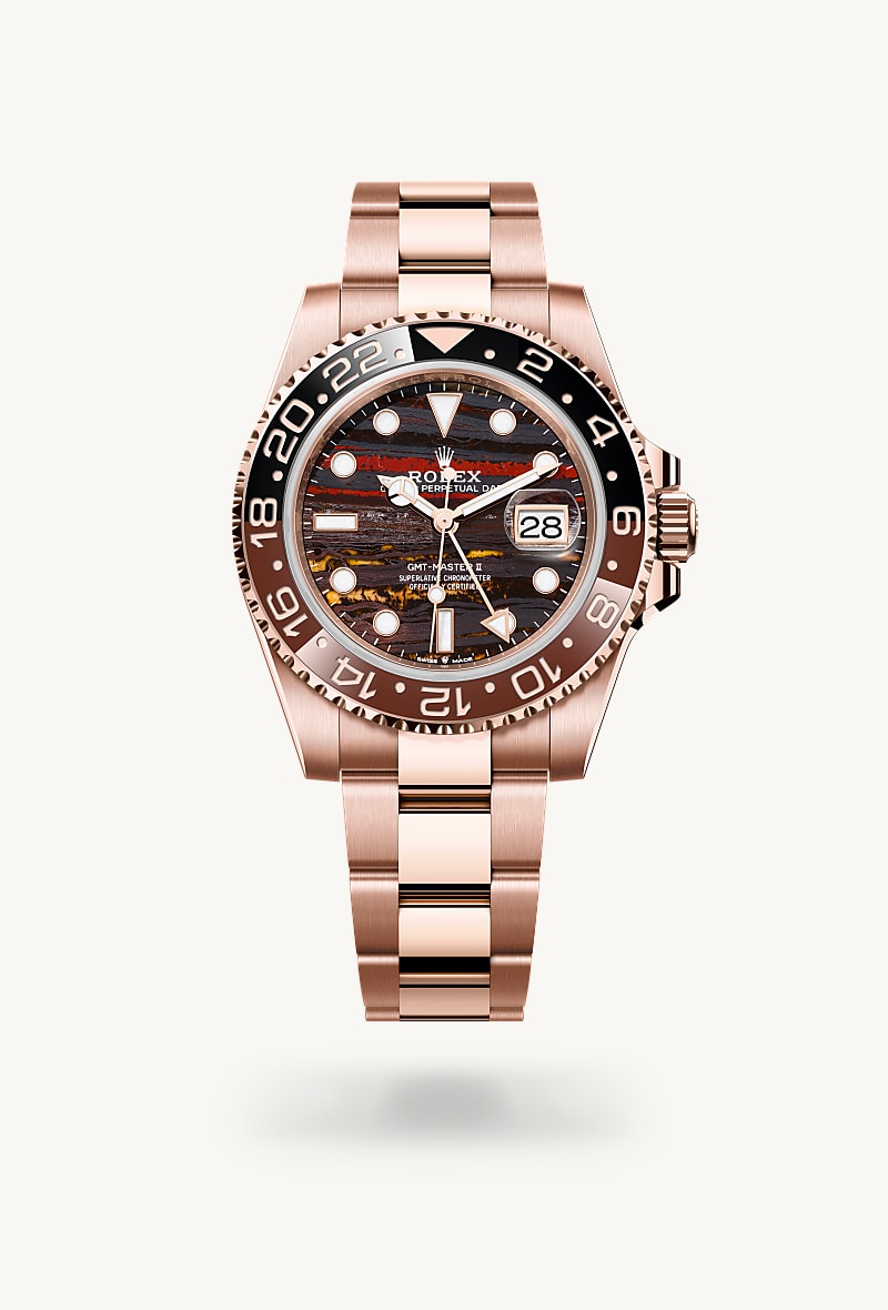 Rolex GMT-Master II in 18 kt Everose gold with a tiger iron dial, bidirectional rotatable 24-hour graduated bezel. two-colour brown and black cerachrom insert in ceramic, moulded numerals and graduations bezel, and Oyster bracelet.