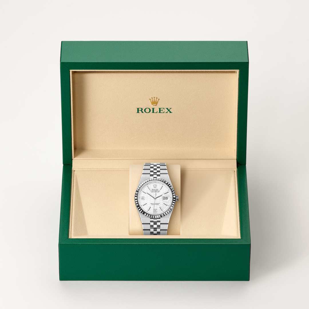 Rolex Land-Dweller 36 in White Rolesor with a intense white, honeycomb motif dial, fluted bezel, and Flat Jubilee bracelet.
