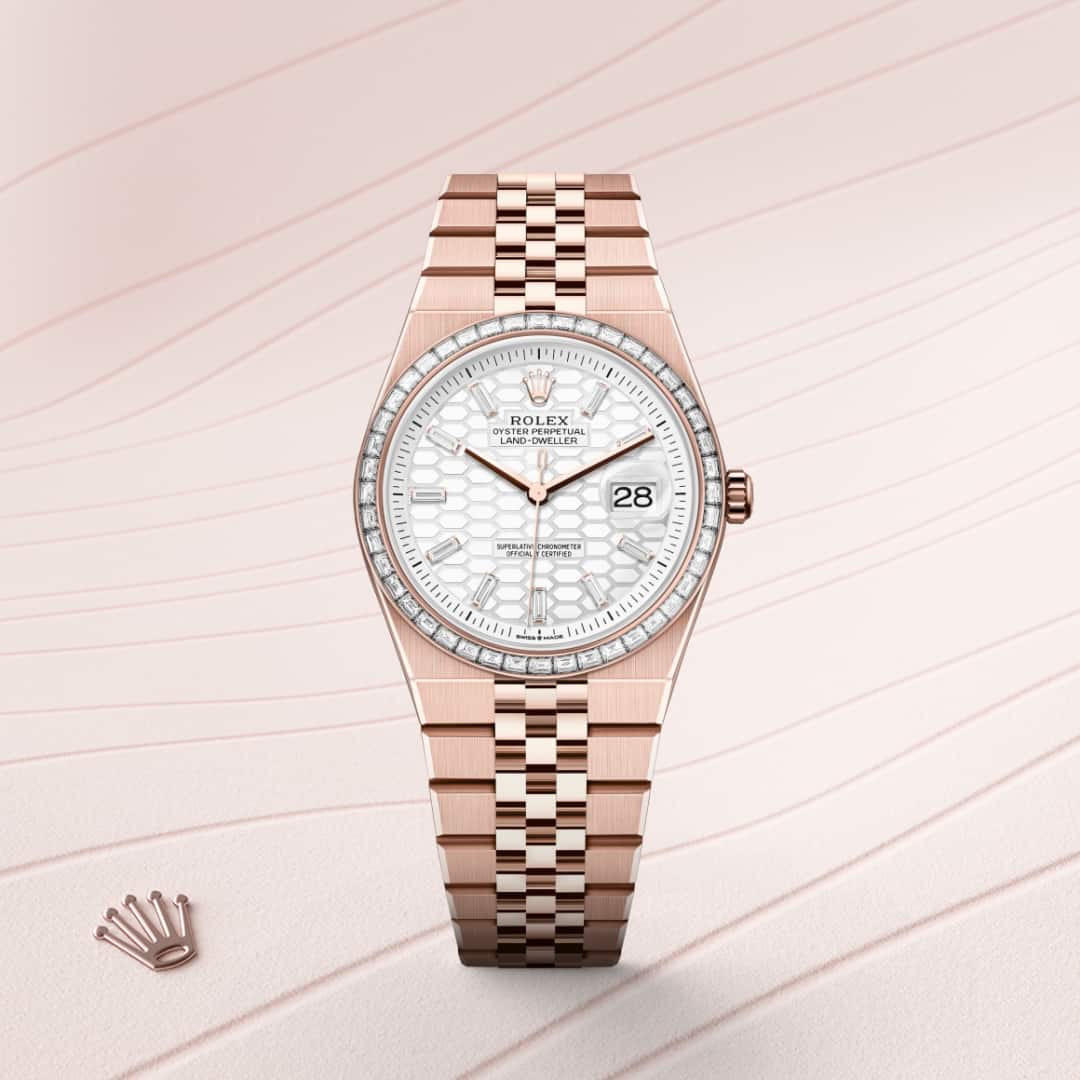 Rolex Land-Dweller 36 in 18 kt Everose gold with a intense white, honeycomb motif set with diamonds dial, set with diamonds bezel, and Flat Jubilee bracelet.