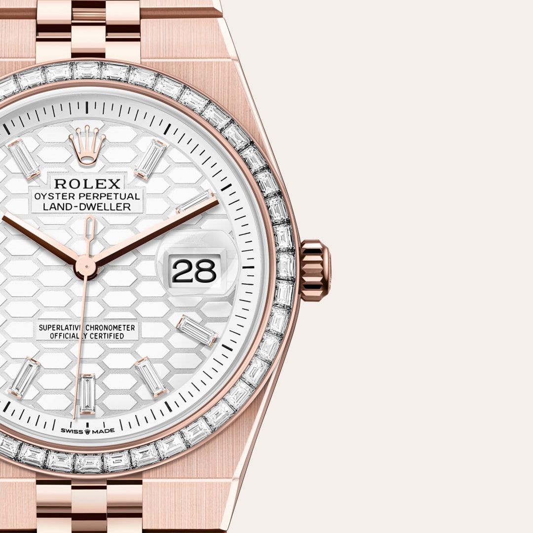Rolex Land-Dweller 36 in 18 kt Everose gold with a intense white, honeycomb motif set with diamonds dial, set with diamonds bezel, and Flat Jubilee bracelet.