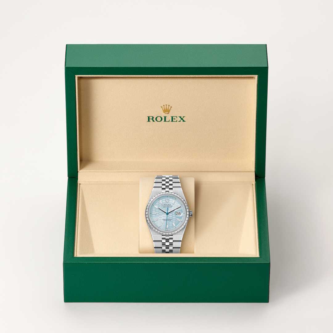 Rolex Land-Dweller 36 in Platinum with a ice blue, honeycomb motif set with diamonds dial, set with diamonds bezel, and Flat Jubilee bracelet.