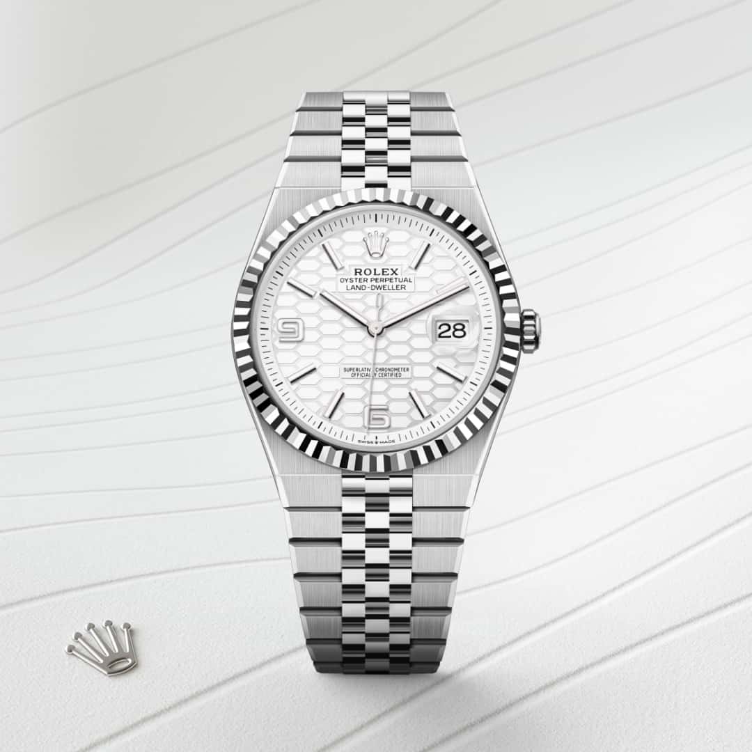Rolex Land-Dweller 40 in White Rolesor with a intense white, honeycomb motif dial, fluted bezel, and Flat Jubilee bracelet.