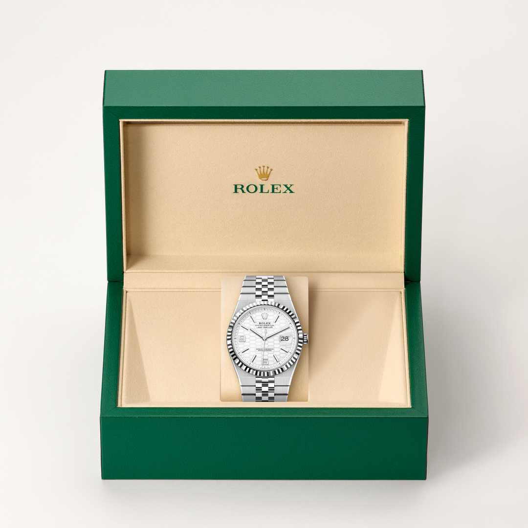 Rolex Land-Dweller 40 in White Rolesor with a intense white, honeycomb motif dial, fluted bezel, and Flat Jubilee bracelet.