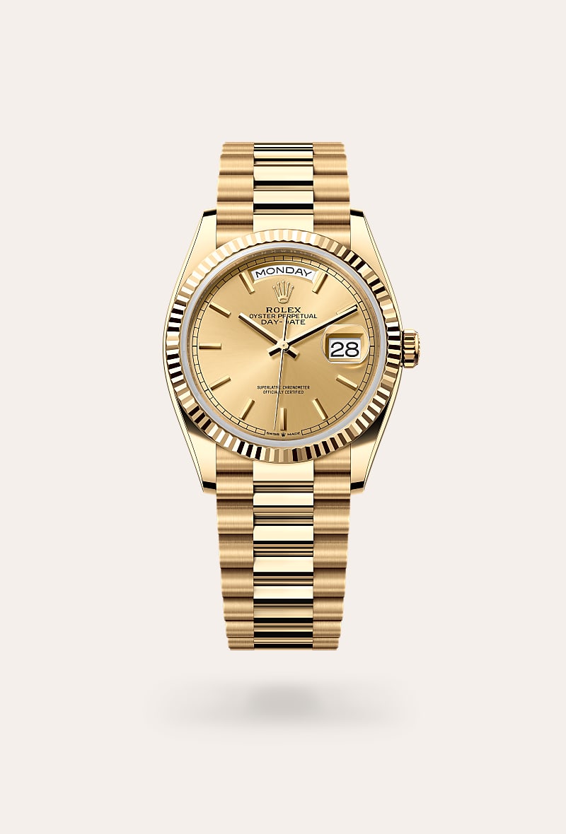 Rolex Day-Date 36 in 18 kt yellow gold with a champagne-colour dial, fluted bezel, and President bracelet.