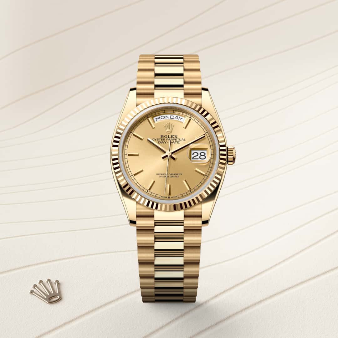Rolex Day-Date 36 in 18 kt yellow gold with a champagne-colour dial, fluted bezel, and President bracelet.