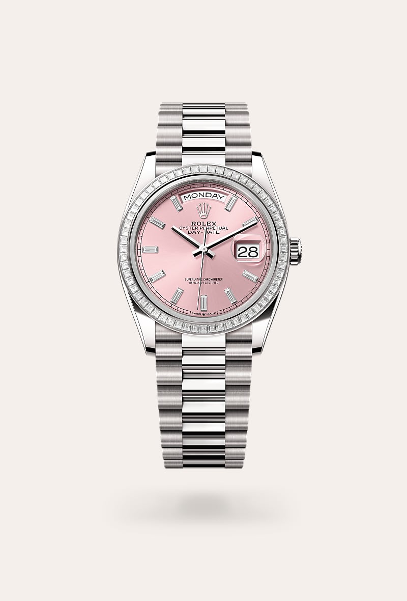 Rolex Day-Date 36 in 18 kt white gold with a pink set with diamonds dial, set with diamonds bezel, and President bracelet.