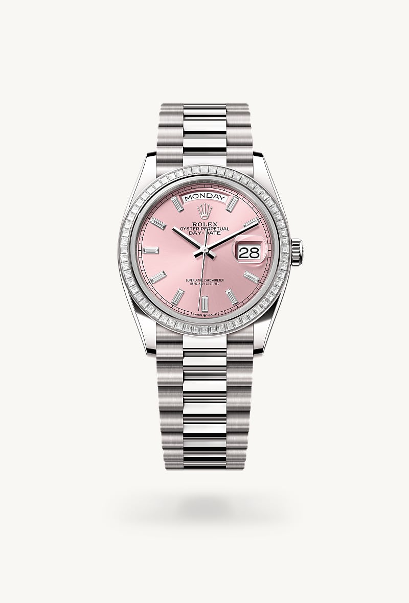 Rolex Day-Date 36 in 18 kt white gold with a pink set with diamonds dial, set with diamonds bezel, and President bracelet.