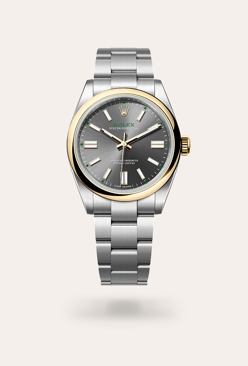 Rolex Oyster Perpetual 41 in Yellow Rolesor with a slate dial, domed bezel, and Oyster bracelet.