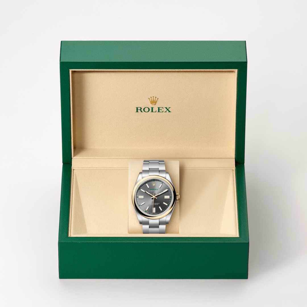 Rolex Oyster Perpetual 41 in Yellow Rolesor with a slate dial, domed bezel, and Oyster bracelet.