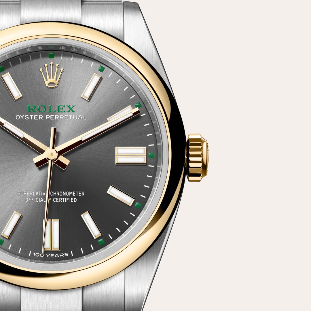 Rolex Oyster Perpetual 41 in Yellow Rolesor with a slate dial, domed bezel, and Oyster bracelet.