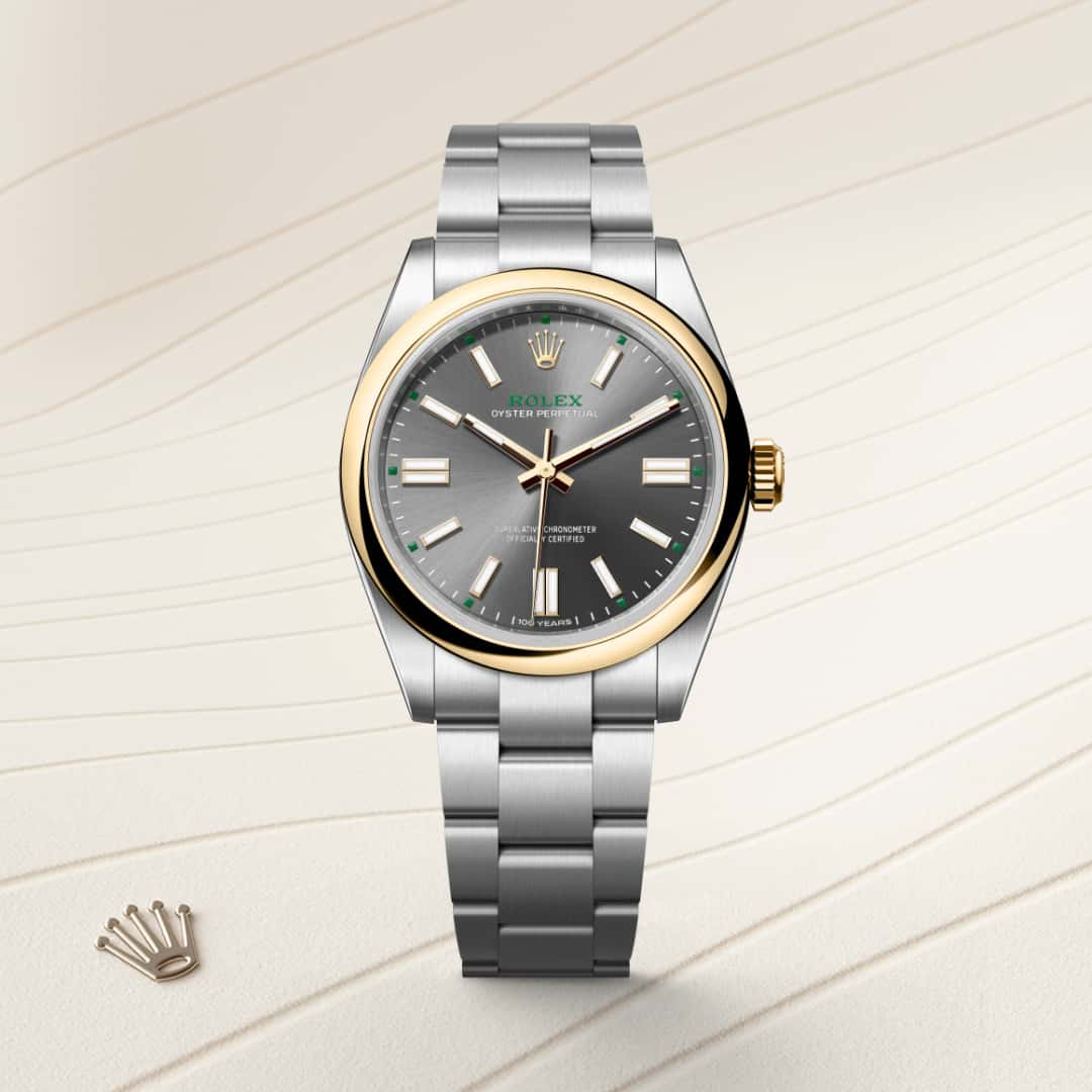 Rolex Oyster Perpetual 41 in Yellow Rolesor with a slate dial, domed bezel, and Oyster bracelet.