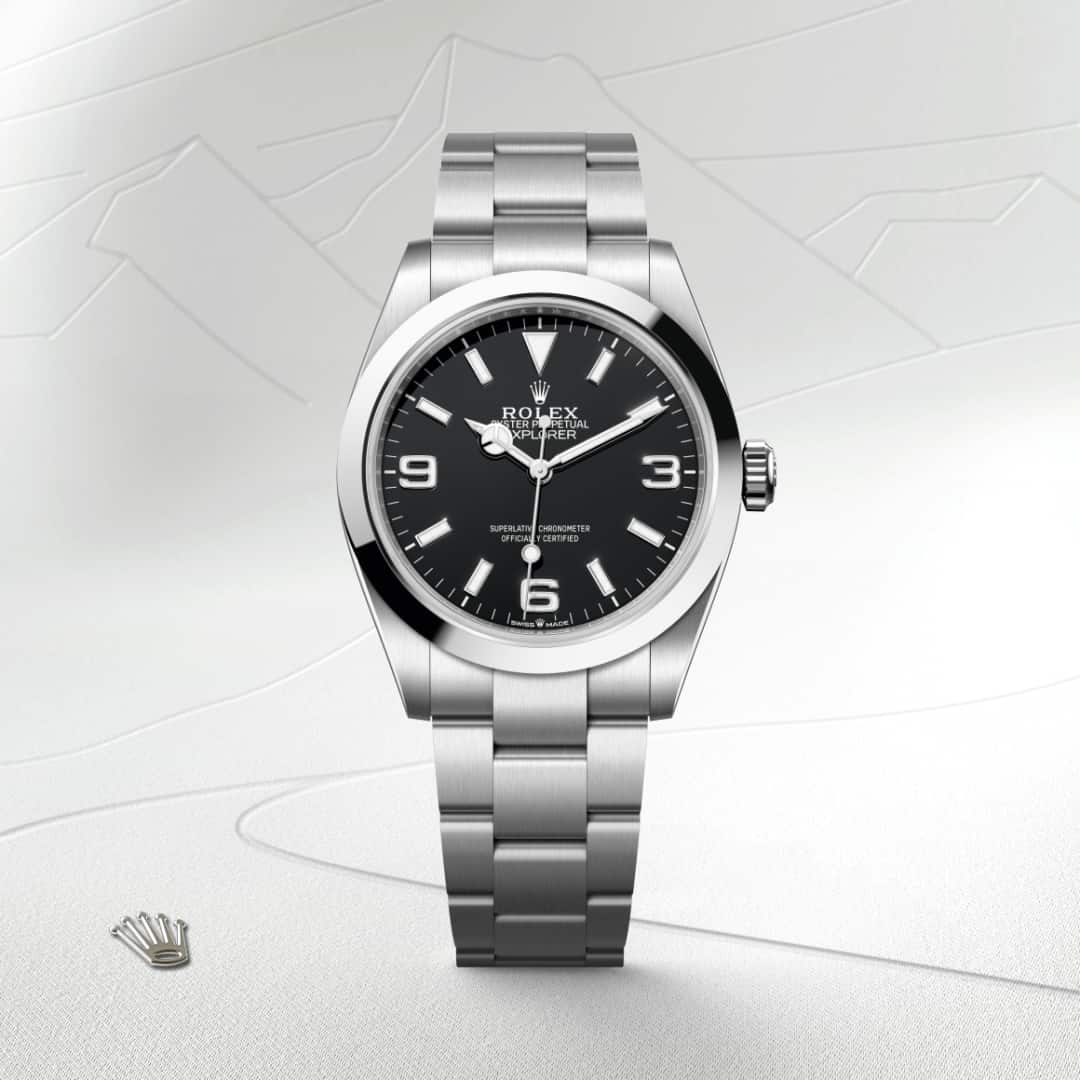 Rolex Explorer 40 in Oystersteel with a black dial, smooth bezel, and Oyster bracelet.