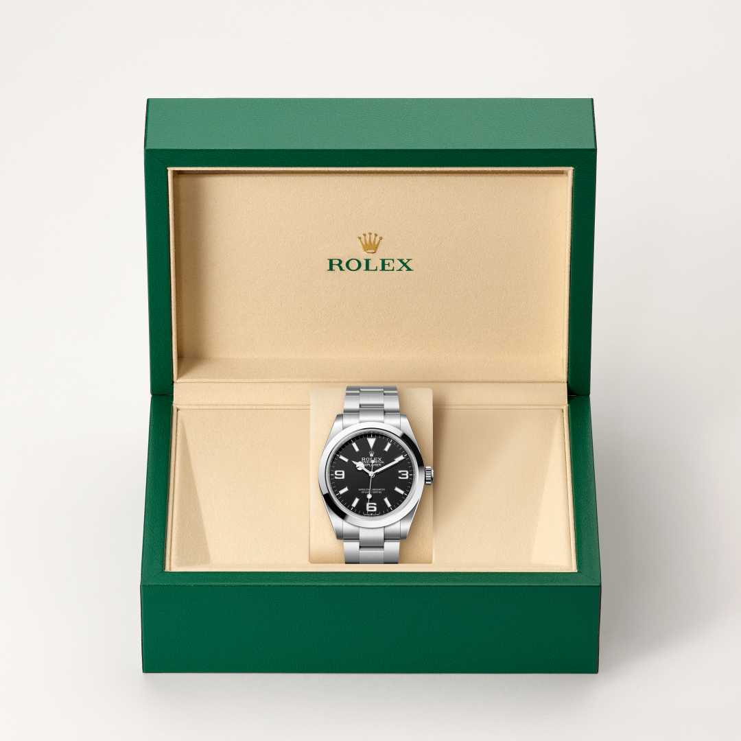 Rolex Explorer 40 in Oystersteel with a black dial, smooth bezel, and Oyster bracelet.