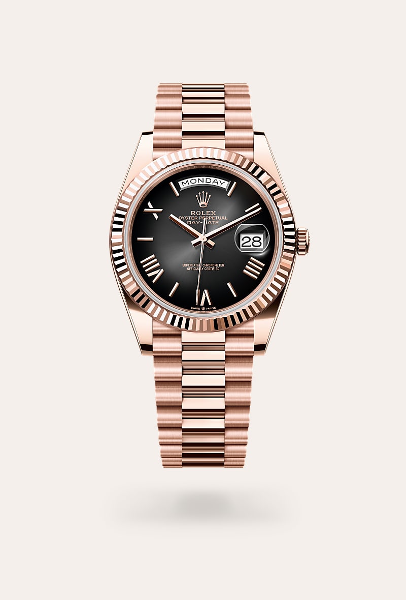 Rolex Day-Date 40 in 18 kt Everose gold with a slate ombr&eacute; dial, fluted bezel, and President bracelet.