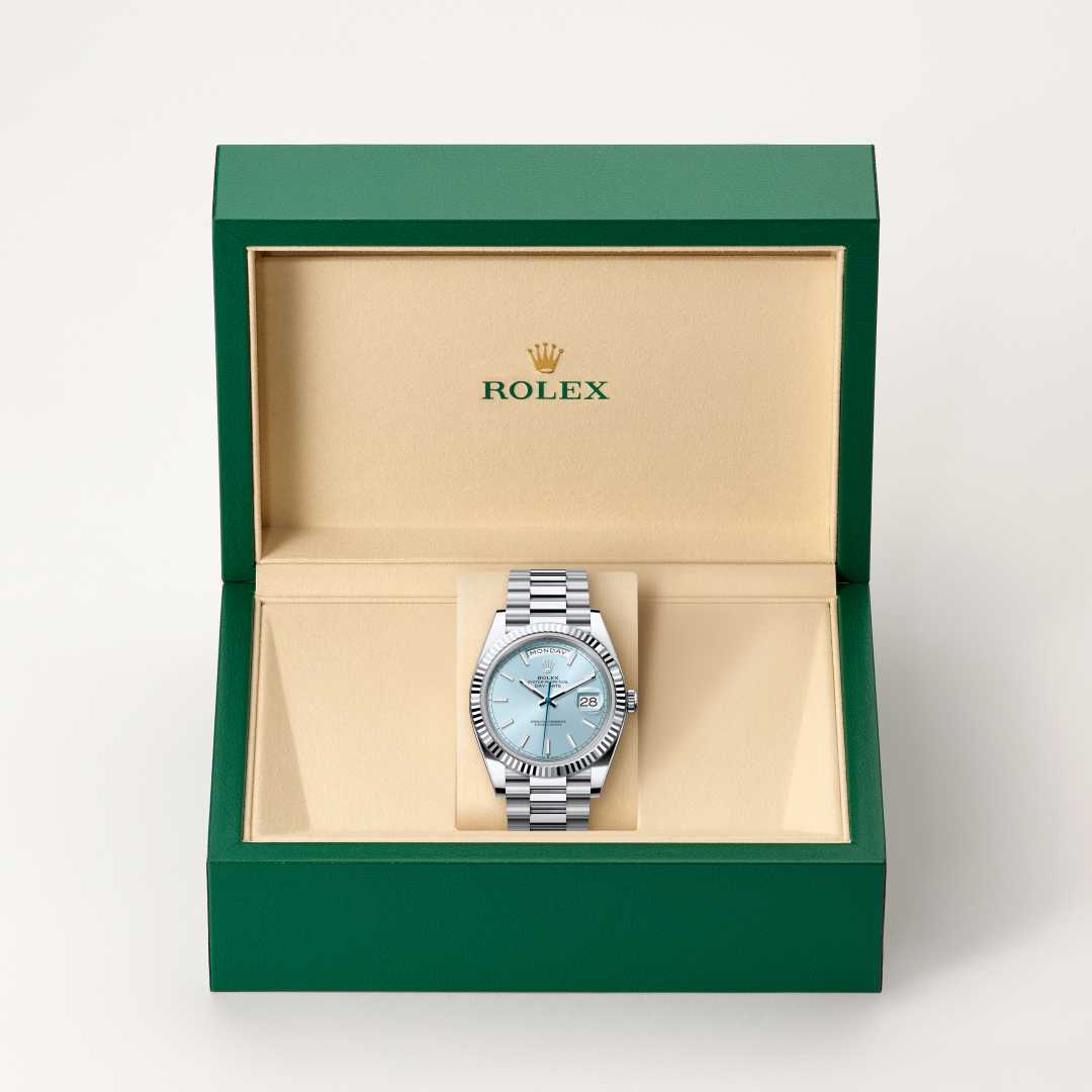 Rolex Day-Date 40 in Platinum with a ice blue dial, fluted bezel, and President bracelet.