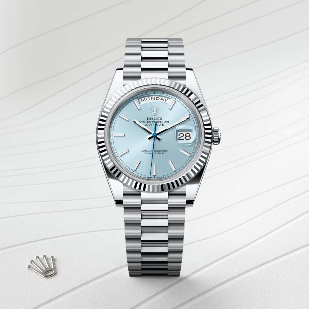 Rolex Day-Date 40 in Platinum with a ice blue dial, fluted bezel, and President bracelet.