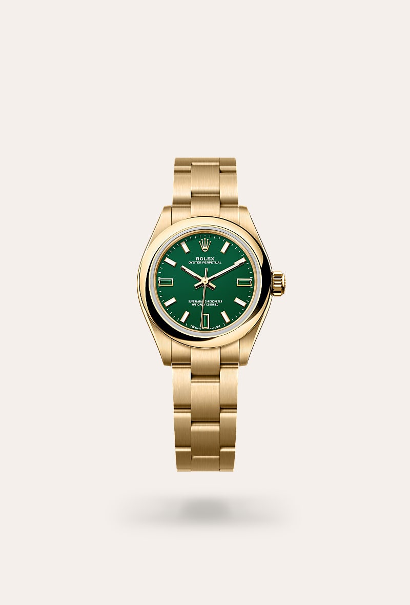 Rolex Oyster Perpetual 28 in 18 ct yellow gold with a green stone dial, domed bezel, and Oyster bracelet.