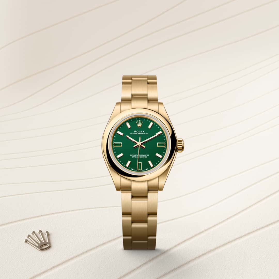 Rolex Oyster Perpetual 28 in 18 ct yellow gold with a green stone dial, domed bezel, and Oyster bracelet.