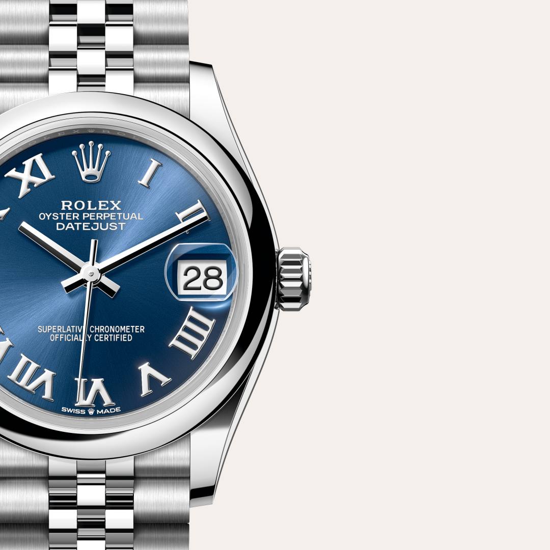 Rolex Datejust 31 in Oystersteel with a bright blue dial, domed bezel, and Jubilee bracelet.