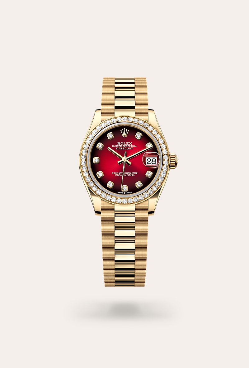 Rolex Datejust 31 in 18 kt yellow gold with a red ombr&eacute; set with diamonds dial, set with diamonds bezel, and President bracelet.