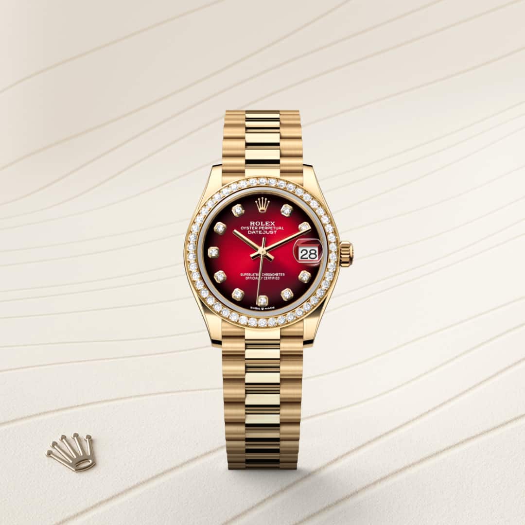 Rolex Datejust 31 in 18 kt yellow gold with a red ombré set with diamonds dial, set with diamonds bezel, and President bracelet.